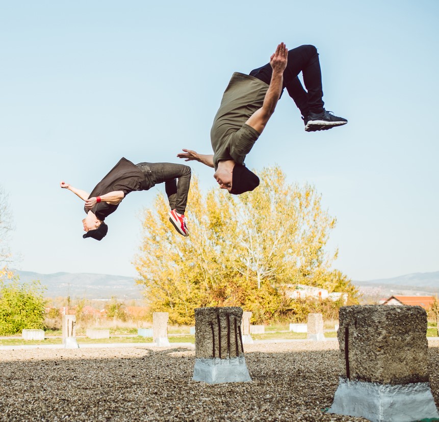 Two men doing free running parkour Parkour